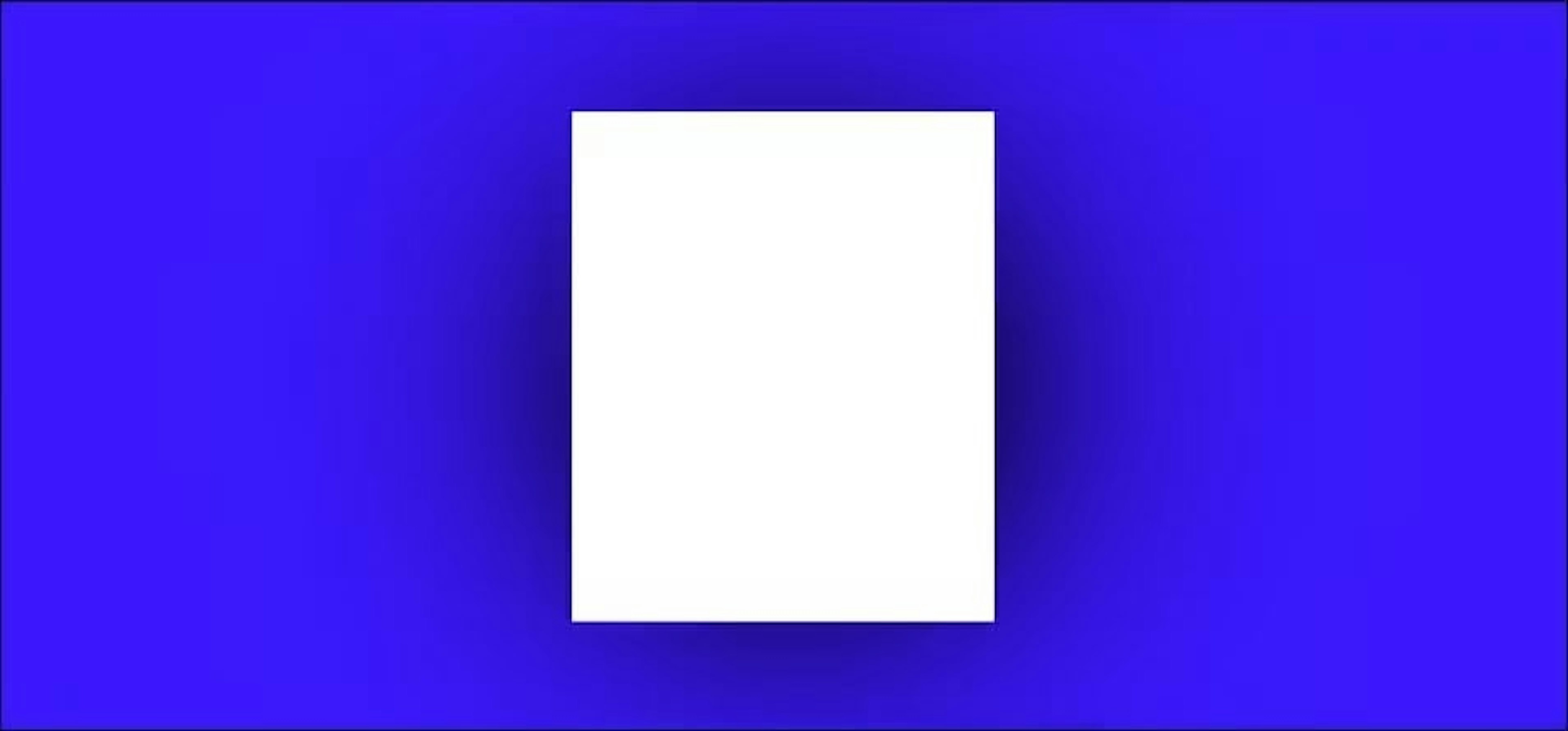 A blank piece of paper on a blue background with a dramatic shadow, representing the challenge of starting to write.