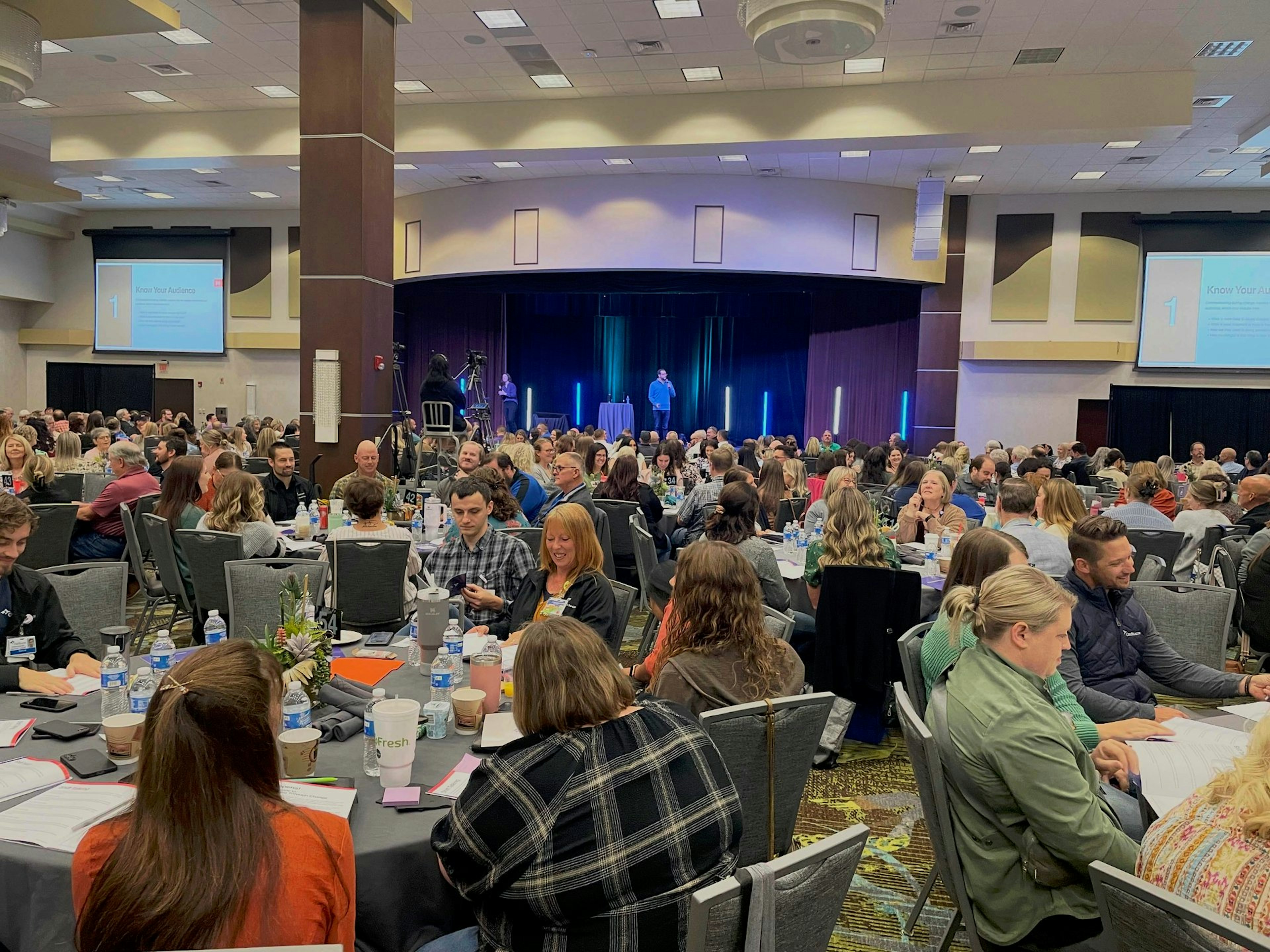 Habitat team members working together at a conference table.
