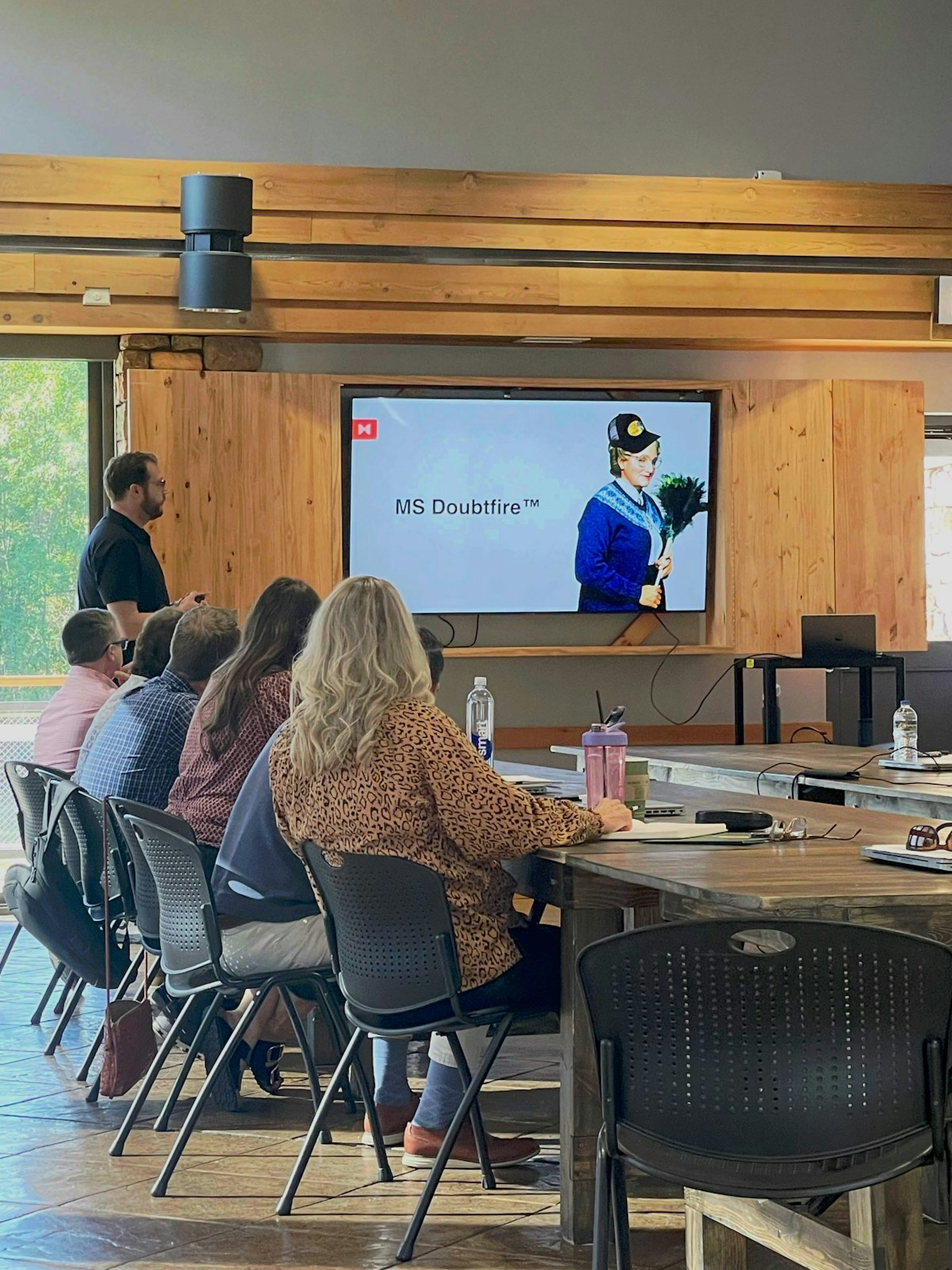 Habitat team members collaborating at a whiteboard during a strategy session.