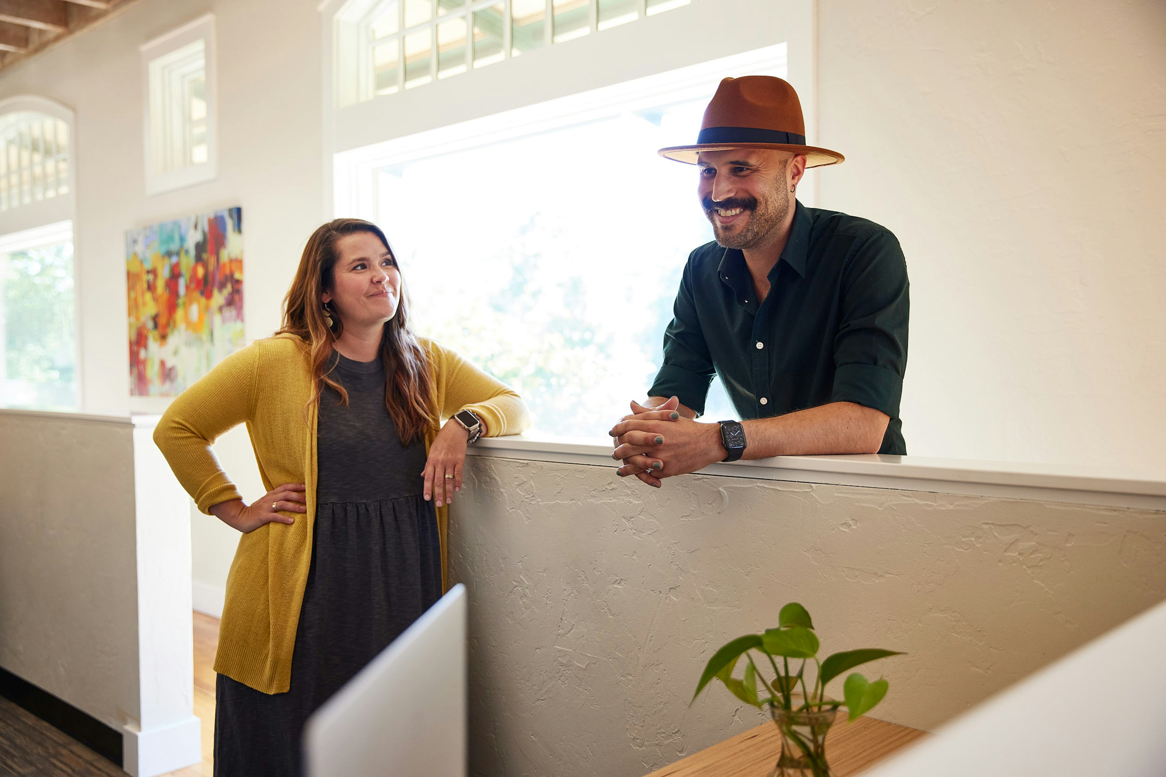 Mostly Serious logo sign on an orange wall.