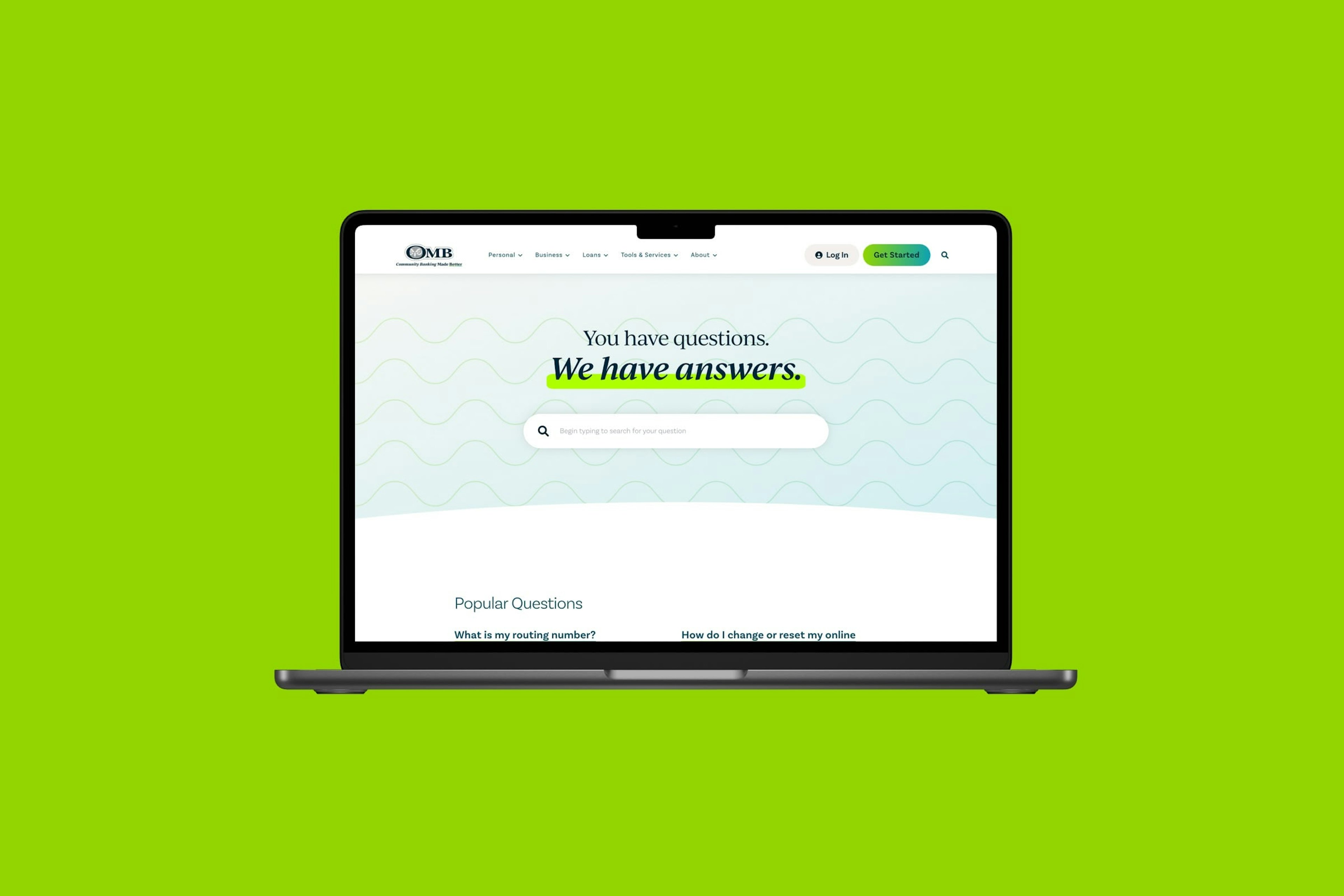 OMB Bank help page displayed on a MacBook laptop against a vibrant lime green background. The page features the headline You have questions with We have answers styled with a distinctive highlight treatment. A search bar invites users to begin typing their questions, with Popular Questions links visible below for common inquiries like routing numbers and password resets.