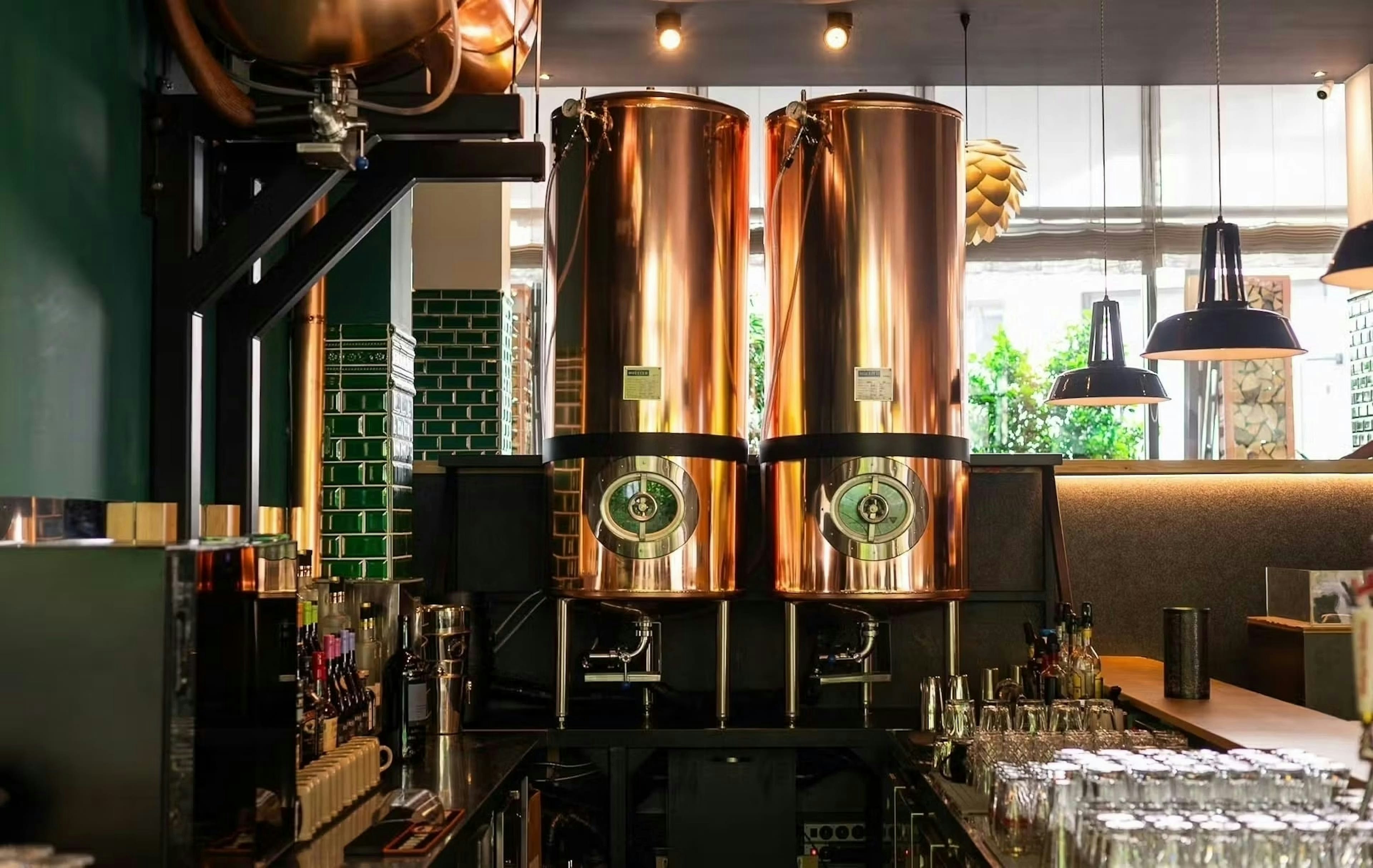 Copper brewing tanks inside a brewery.